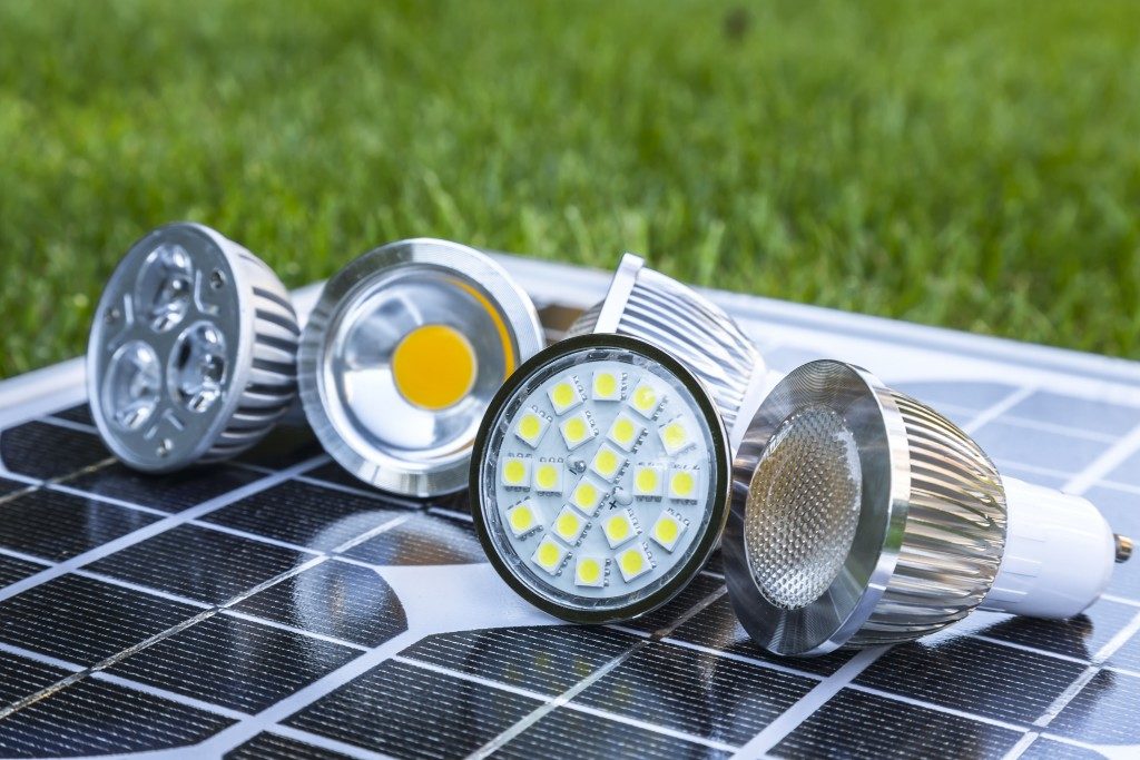 various GU10 LED bulbs on photovoltaics in the grass E27 LED and CFL bulbs