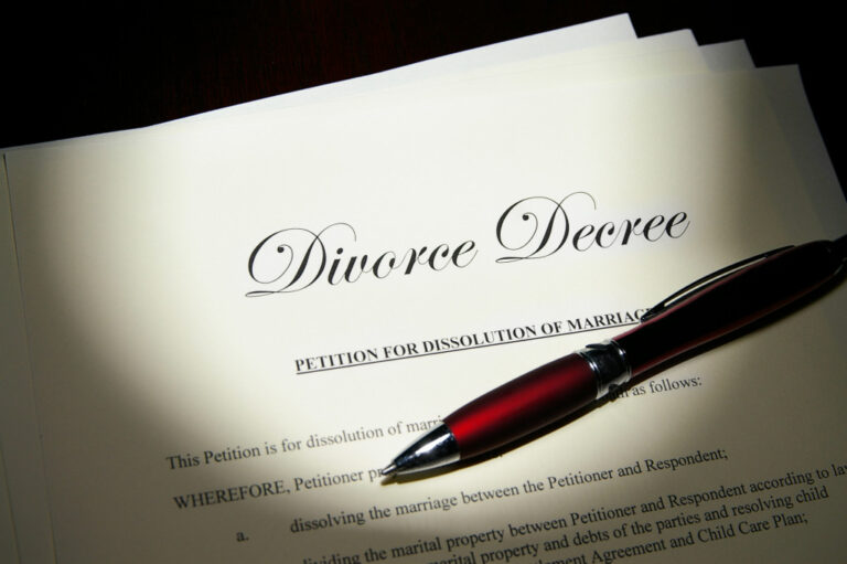 A divorce decree document with pen