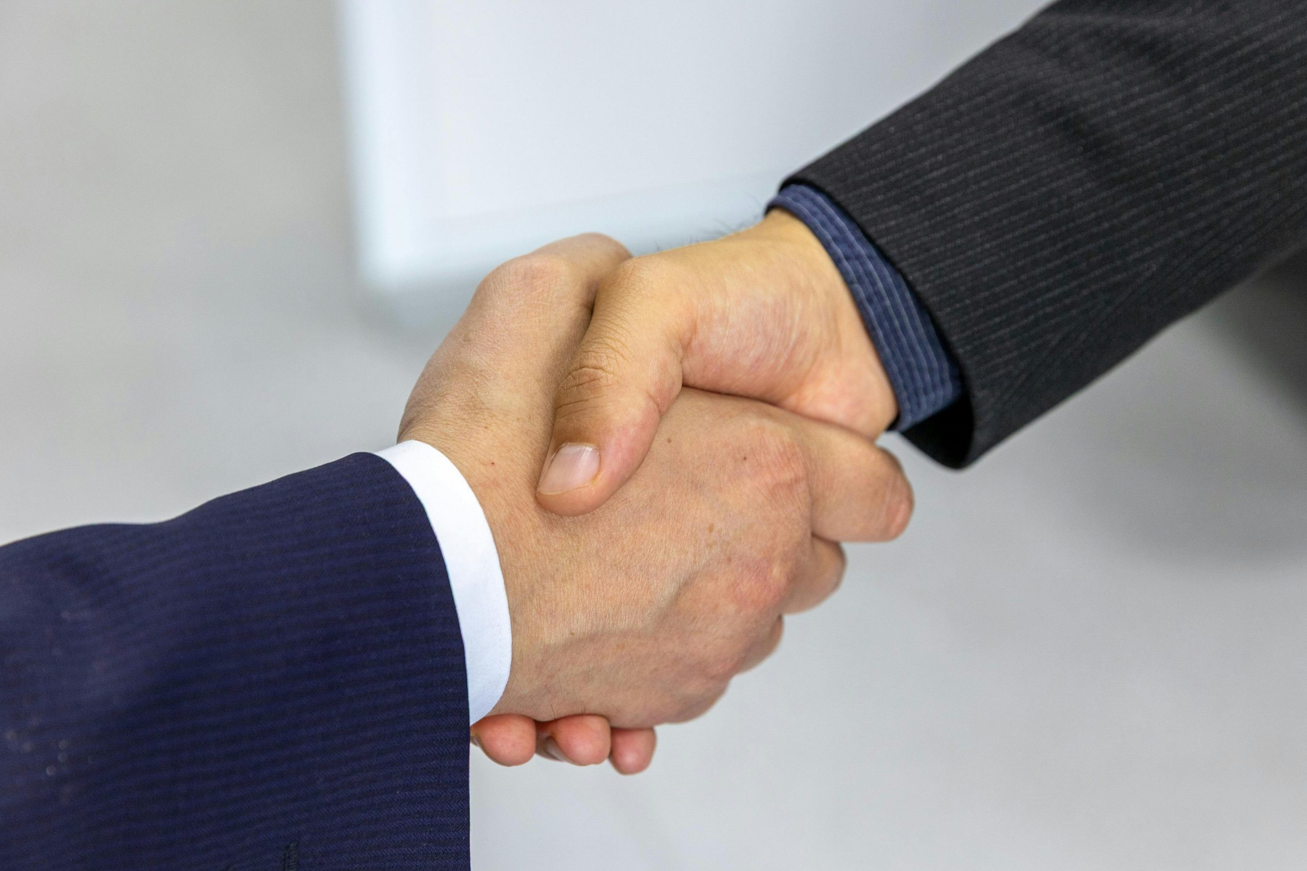 men in suits shaking hands