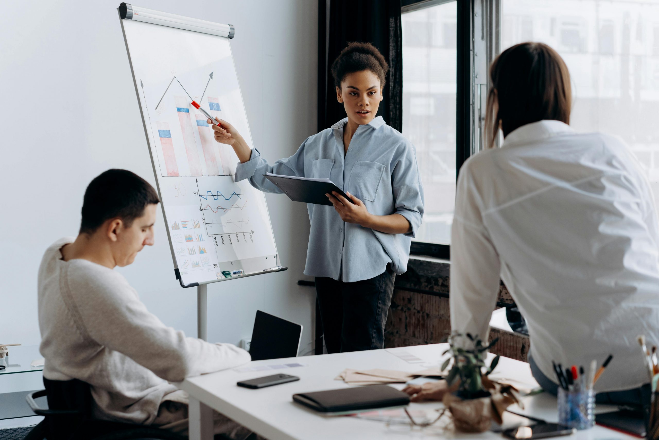woman delivering a presentation in a meeting room